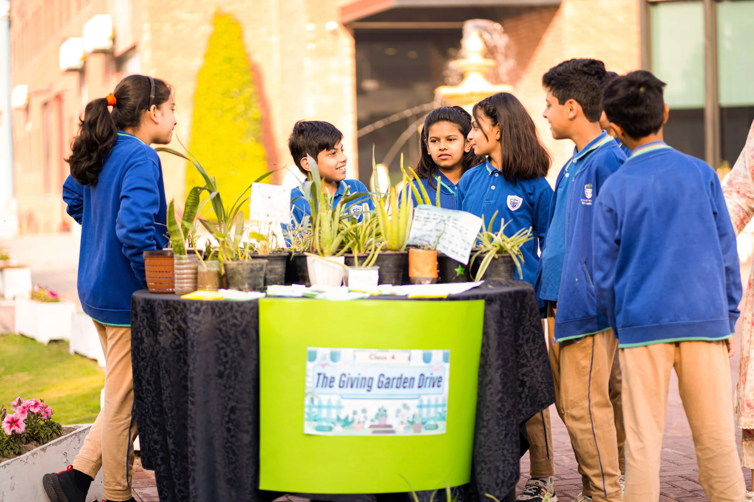 CSI students presenting a plant project outdoors.